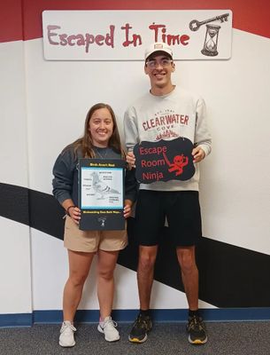 a group of people playing the birds aren't real escape room at Escaped In Time